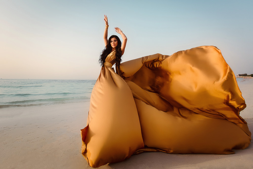 Experience the Allure of Flying Dress Photography in Dubai and Abu Dhabi. Elevate Your Visuals With Captivating Dresses Against Iconic UAE Backdrops. Book Now!