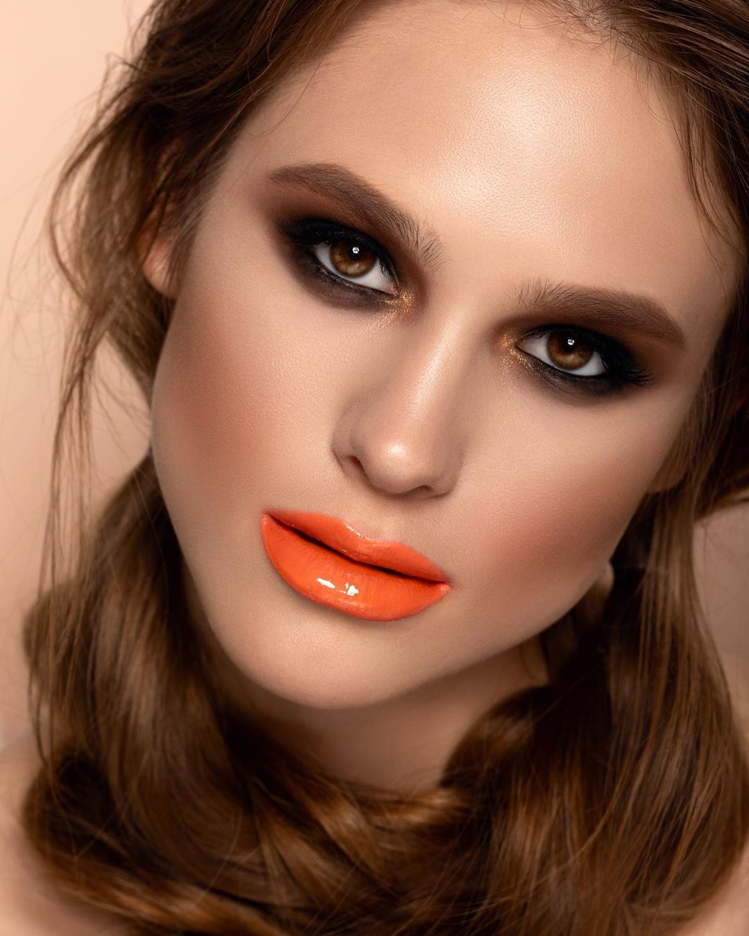 Lady With Stylish Make Up And Orange Lips